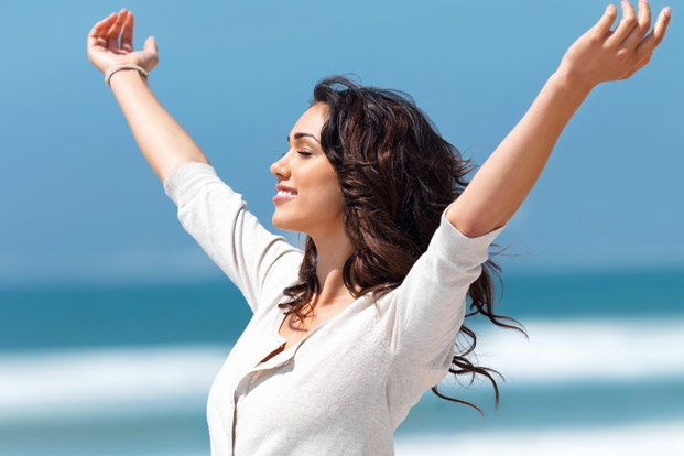 Woman outdoors enjoying improved wellbeing